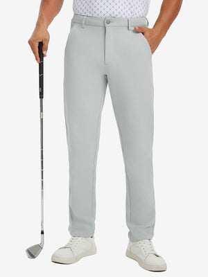 Lightweight moisture wicking dress pants in silver grey, front lower-body with model leaning on golf club.