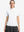 Front upper body shot of model wearing white women's breathable 1/4 zip pullover golf shirts