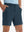 Front lower body shot of model wearing the navy stretch soft flat front dress golf shorts, showcasing the fit