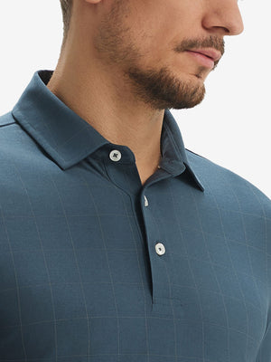 Front view from nose to chest of model wearing dolphin grid performance reflective checked collar golf shirt