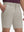 Front lower body shot of model wearing fossil flat front hybrid golf shorts