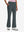 Front lower body shot of model wearing dark grey women's high waist stretch golf pants with pockets