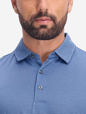 Front view from nose to chest of model wearing light blue navy comfy breathable pin-stripe texture golf polos