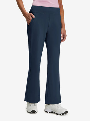 Front lower body shot of model wearing navy women's high waist stretch golf pants with pockets