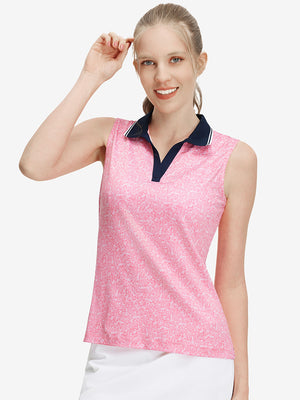Front upper body shot of model wearing pink white florals women's sleeveless v-neck print golf shirts