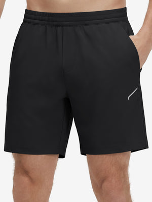 Front lower body shot of model wearing black 4 way stretch breathable workout athletic shorts