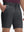 Front lower body shot of model wearing iron grey flat front hybrid golf shorts