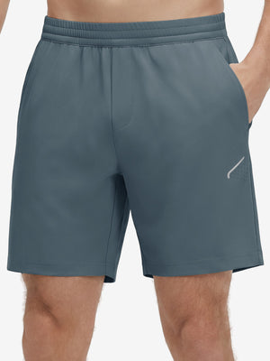 Front lower body shot of model wearing grey blue 4 way stretch breathable workout athletic shorts