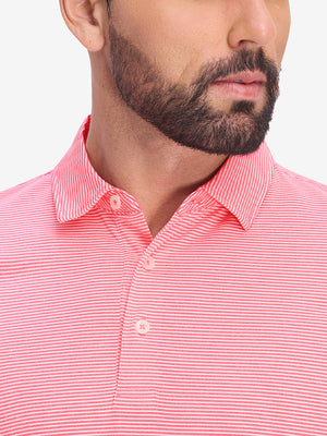 Front view from nose to chest of model wearing pink coral white comfy breathable pin-stripe texture golf polos