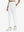 Front lower body shot of model wearing white women's lightweight athletic sweatpants