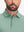 Front shot from nose to chest of model wearing green grey dry fit waffle textured collared golf shirts
