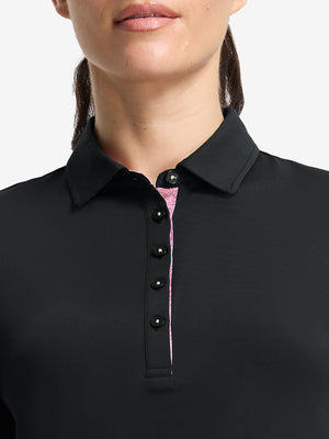 Front shot from nose to chest of model wearing black women's 5 buttons collared polo shirts