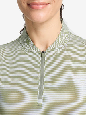 Front shot from nose to chest of model wearing moss green white women's q-zip pin striped texture golf shirts