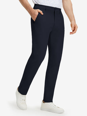 Front lower body shot of model wearing navy stretch cotton blend slim fit golf trousers 5 pockets