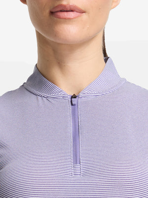Front shot from nose to chest of model wearing light purple white women's q-zip pin striped texture golf shirts