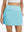 Front lower body shot of model wearing lake green women's stretch a-line golf skort with 7 pockets