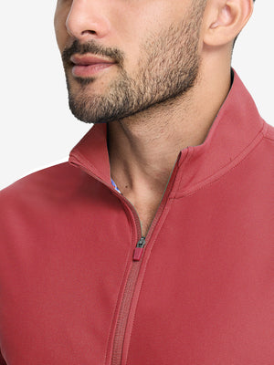 Front view from nose to chest of model wearing brick red waffle texture 1/4 zip pullover