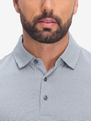 Front view from nose to chest of model wearing navy white comfy breathable pin-stripe texture golf polos