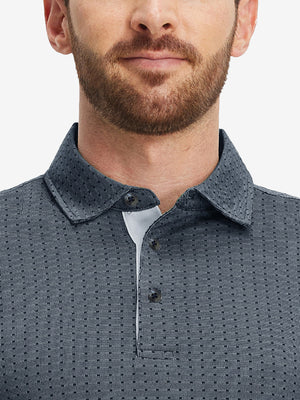 Front shot from nose to chest of model wearing dark blue classic lightweight jacquard golf shirts