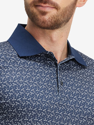 Front view from nose to chest of model wearing dark blue golf premium ribbed collar print polo shirts