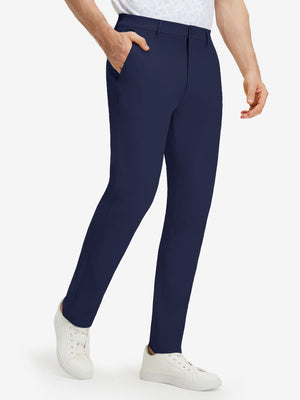 Front lower body shot of model wearing dark blue stretch cotton blend slim fit golf trousers 5 pockets