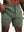 Front lower-body view from waist to knees showing stretch of OLIVE GREEN 2 in 1 Running Sports Shorts with Liner