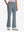 Front lower body shot of model wearing grey blue women's high waist stretch golf pants with pockets