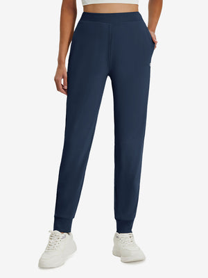 Front lower body shot of model wearing navy women's lightweight athletic sweatpants