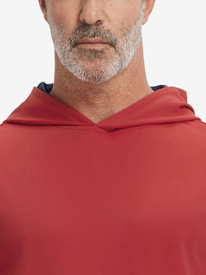 Close-up from nose to chest, showing soft collar texture and stitching detail of the red hoodie.