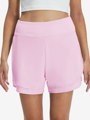 Front lower body shot of model wearing light pink women's gym golf shorts with liner pocket