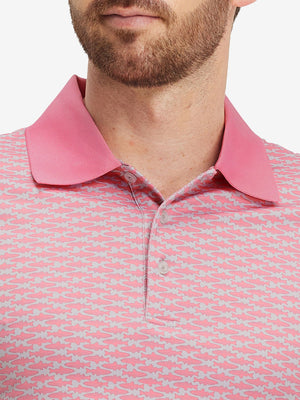 Front view from nose to chest of model wearing pink small fish premium ribbed collar print polo shirts