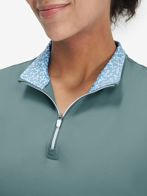 Front view from nose to chest of model wearing dusty blue women's athletic quarter zip tank tops
