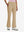 Front lower body shot of model wearing light khaki women's high waist stretch golf pants with pockets