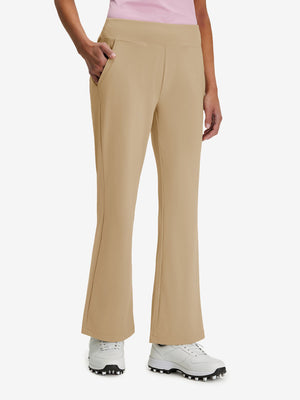 Front lower body shot of model wearing light khaki women's high waist stretch golf pants with pockets