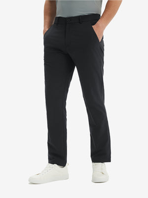 Front lower-body view of model in black  stretch quick dry casual golf pants with 4 pockets
