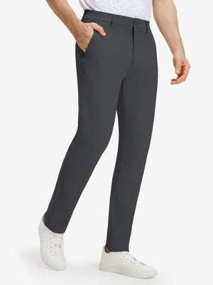 Front lower body shot of model wearing dark grey stretch cotton blend slim fit golf trousers 5 pockets
