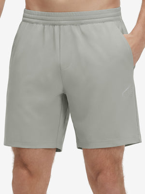 Front lower body shot of model wearing silver gray 4 way stretch breathable workout athletic shorts