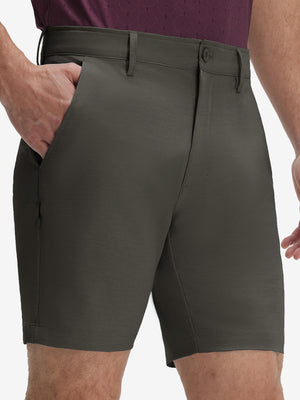 Front lower body shot of model wearing tea brown flat front hybrid golf shorts