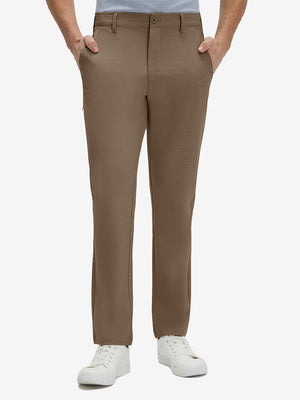 Front lower body shot of model wearing tobacco brown straight fit lightweight dress golf pants