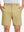 Front lower body shot of model wearing khaki flat front flex cotton blend golf shorts