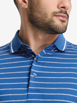 Front shot from nose to chest of model wearing classic blue/airy blue non-curl ribbed collar striped polo shirts