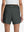 Back lower body shot of model wearing dark grey women's gym golf shorts with liner pocket