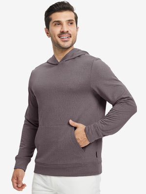 Model front view with one hand in side pocket wearing warm fleece golf hoodies pullover dark red.
