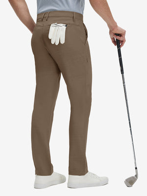 Back lower body shot of model wearing tobacco brown straight fit lightweight dress golf pants