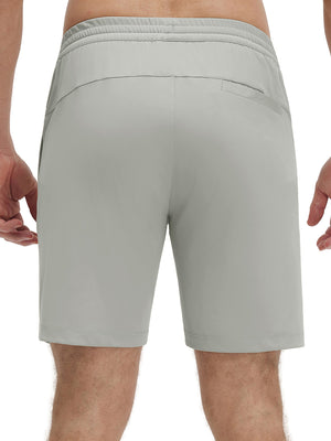 Back lower body shot of model wearing silver gray 4 way stretch breathable workout athletic shorts