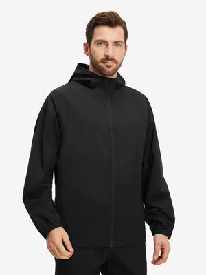 Front upper body shot of model wearing black waterproof lightweight rain jacket with hood