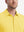 Model front view from nose to chest wearing yellow cotton blend plain shirt.