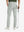 Rear lower-body: model in light grey stretch quick dry casual golf pants with 4 pockets holding golf club in right hand.