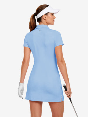 Back upper body view in light blue of women's lightweight golf dress with 2 pockets.