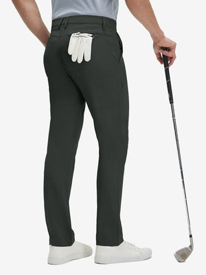 Back lower body shot of model wearing dark charcoal straight fit lightweight dress golf pants